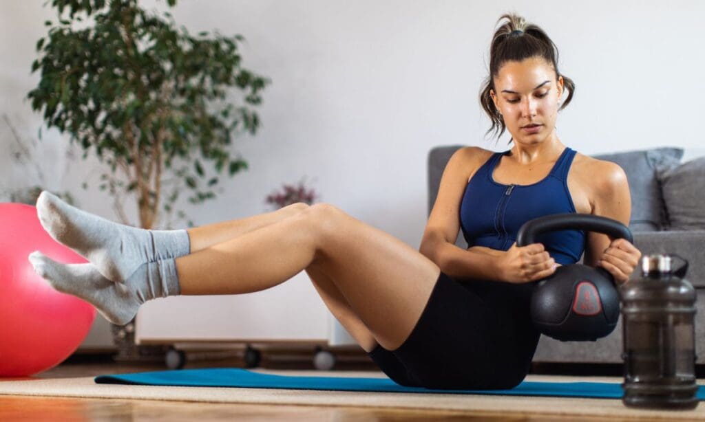 What are the best exercises to do with a kettlebell for core strength at home? FITPAA