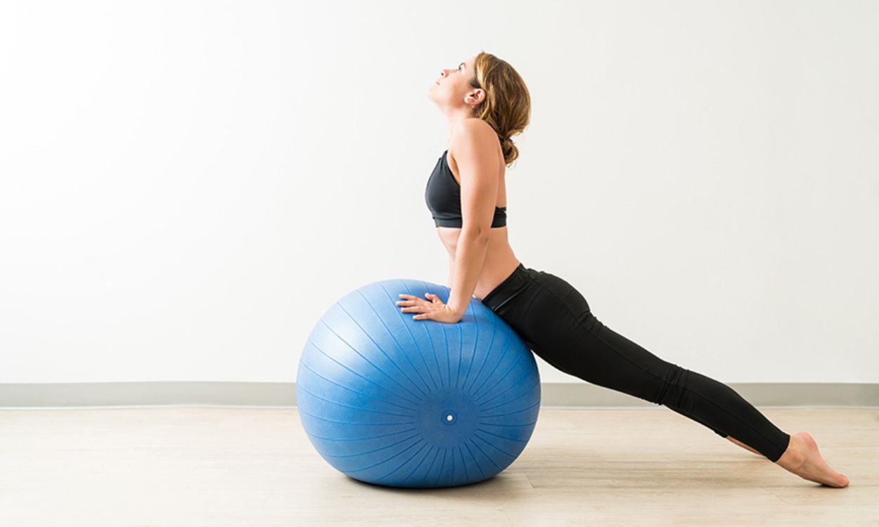 How can I work out my upper back using a stability ball at home